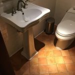 water flowing from bathroom sink